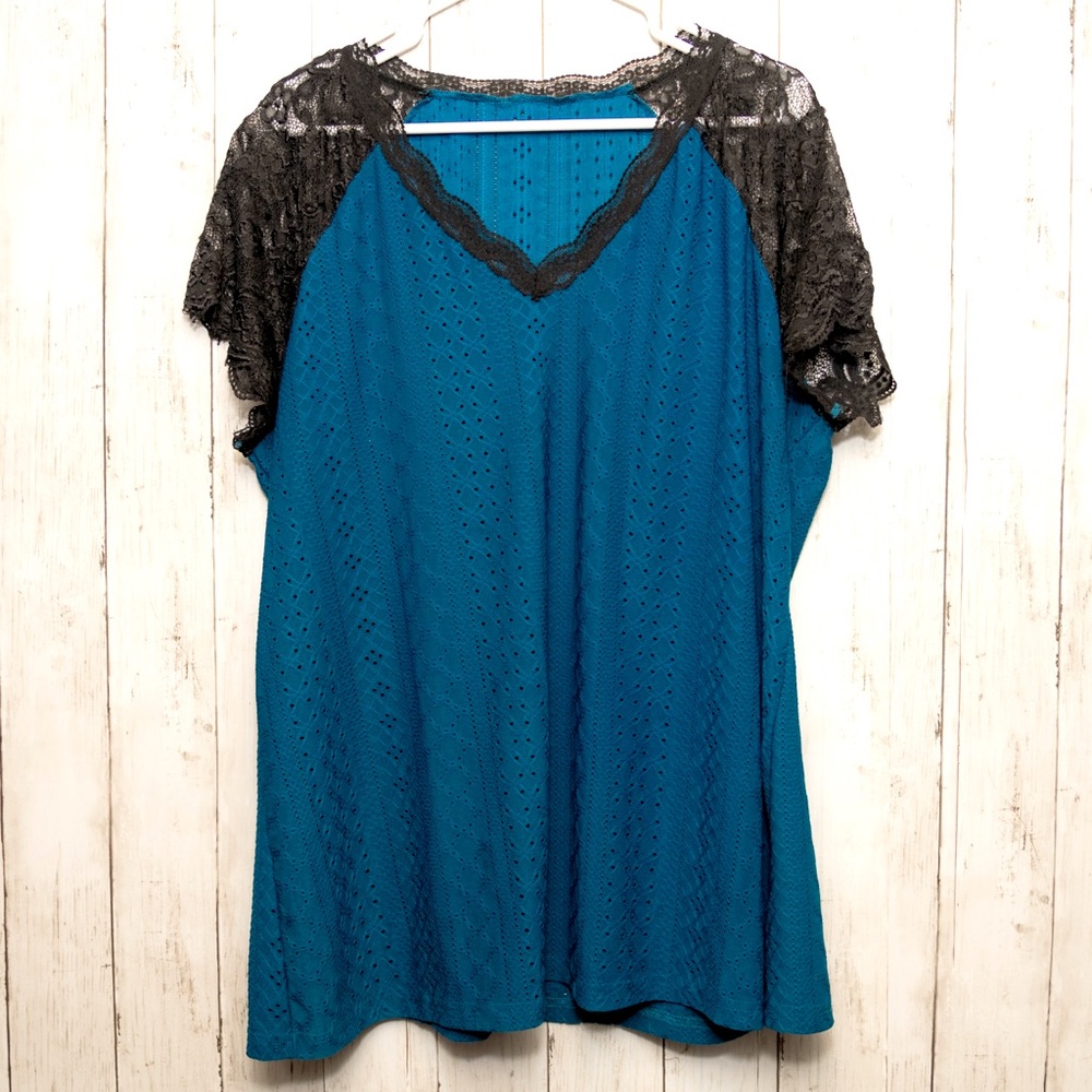 Sheer teal blouse with lace flutter sleeve & neckline.